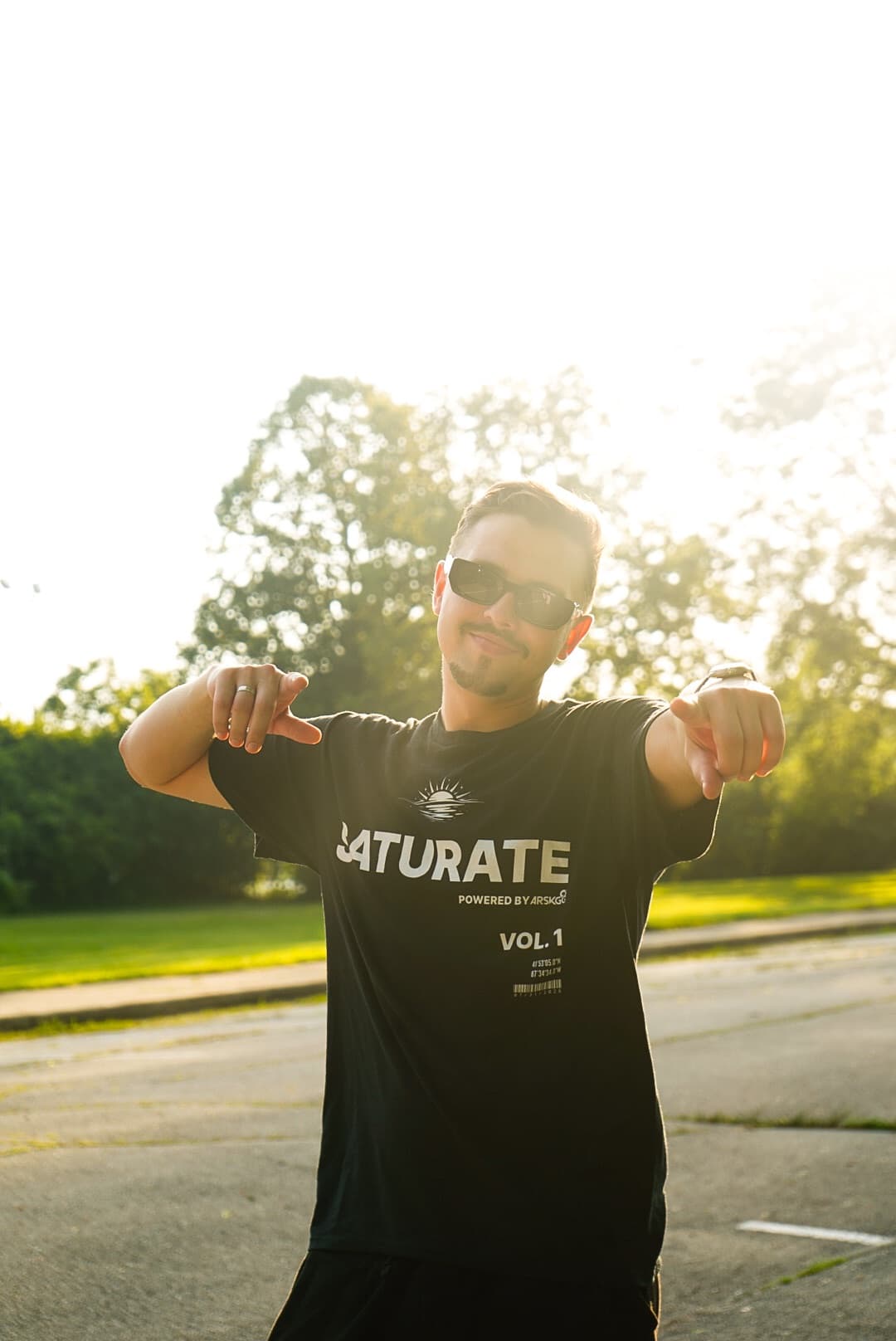 ARSKGG at golden hour in a SATURATE t-shirt