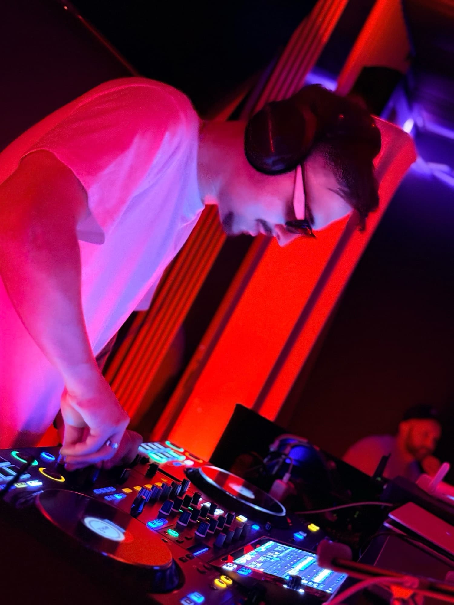 ARSKGG at the decks under red neon light